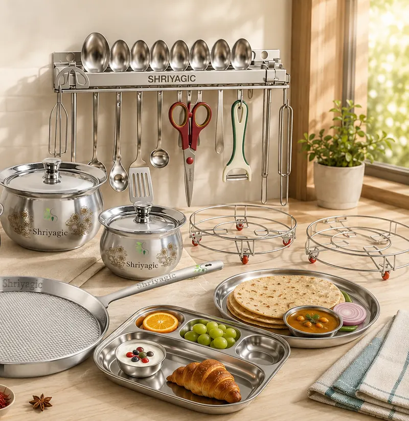 Steel handis, a mesh tawa and a divided tray below a wall utensil rack